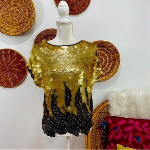 Beautiful Oleg Cassini dressy top. Covered in palettes , gold and black a beauty